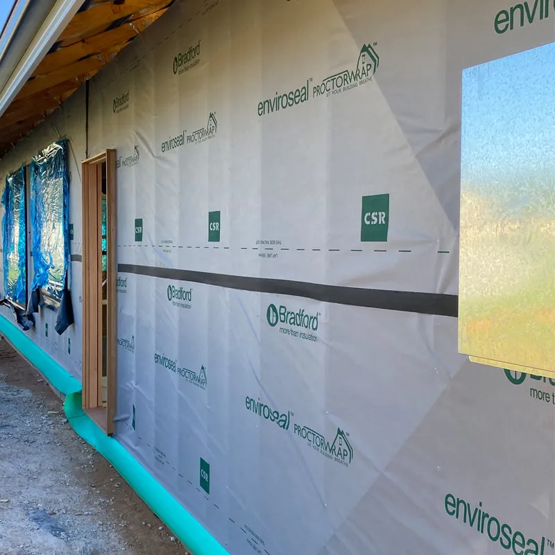 Bradford Enviroseal wall wrap on a new house, with a window opening and doorway